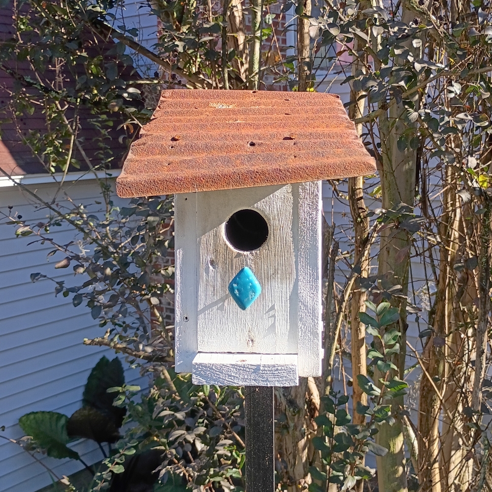 Rustic Birdhouse with Brown Roof and Blue Accent